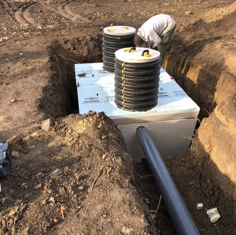 Septic system contractor working on install